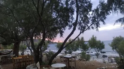 a view of a river with tables and chairs at Georgoshouse Lykos beach Sfakia in Livanianá