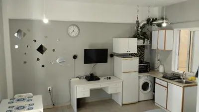 a kitchen with a sink and a microwave at central cozy and lovely house in Chania Town