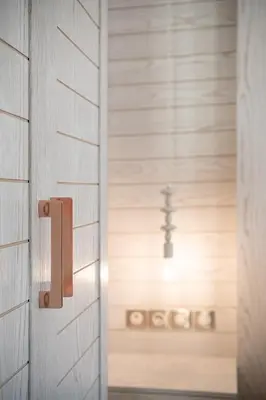 an open door with a cross in the background at La Torre Villa in Palio Gerani