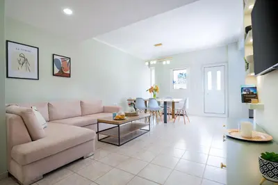 a living room with a couch and a table at Gigis Apartment in Chania Town