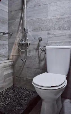a bathroom with a toilet and a shower at Cozy rooms at the old Venetian Harbor, Chania Town in Chania Town