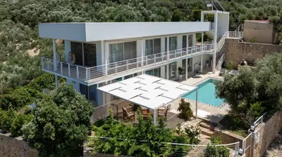 an aerial view of a house with a swimming pool at Freya's Royal Estate, Kissamos in Khairethianá