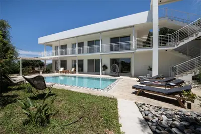 a house with a swimming pool in front of it at Freya's Royal Estate, Kissamos in Khairethianá