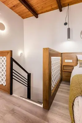 a bedroom with a bed and a wooden ceiling at Casa Nicola's in Chania Town