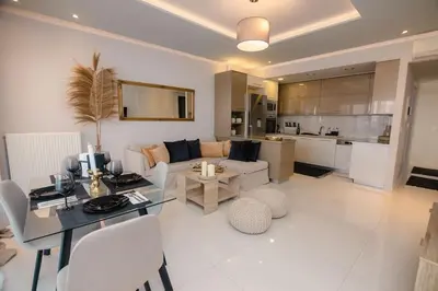 a living room with a dining table and a living room at G&M Luxury Residence with pool in Chania Town