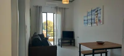 a living room with a couch and a table at Sun Beach Apartments in Chania 8 &10& 13 in Chania Town