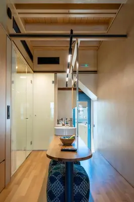 a kitchen with a wooden table in a room at Kallergon Luxury Suites in Chania Town