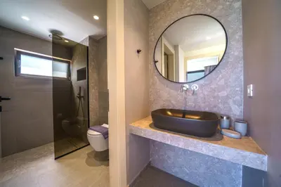 a bathroom with a sink and a mirror at ISKIOS Premium in Agia Marina Nea Kydonias