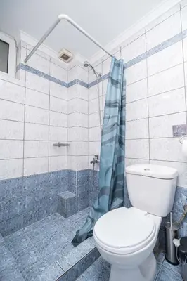 a bathroom with a toilet and a shower at ''Meraviglia'' casa ''Nefeli'' in Chania Town