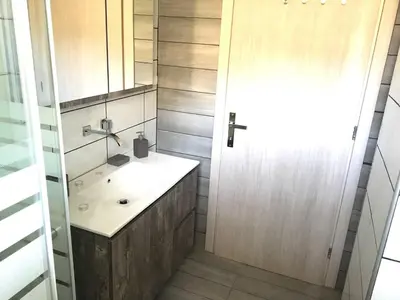 a bathroom with a sink and a mirror at Pegasus Amazing Flat, 1,5min Walk To The Beach in Chania Town