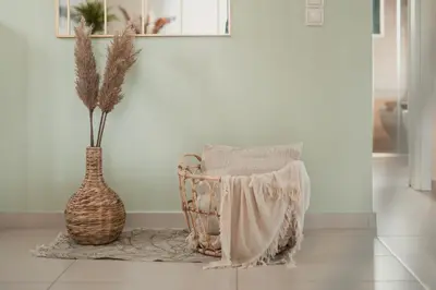 a vase and a chair in a room with a vase at Helen Sweet Home in Kounoupidhianá