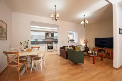 a living room with a table and a couch at Cactus Residence Chania in Chania Town