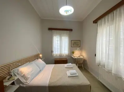 a bedroom with a bed with two towels on it at Efi’s House in Chania Town