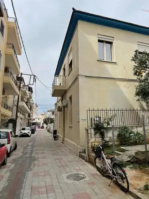 a bike parked on a sidewalk next to a building at Efi’s House in Chania Town