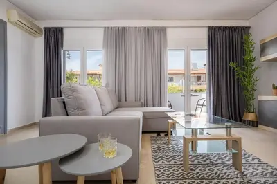 a living room with a couch and a table at Stefanos apartment Chania in Chania Town
