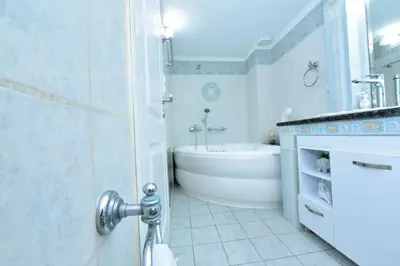 a bathroom with a tub and a sink and a bath tub at Zilina Homes2 in Chania Town