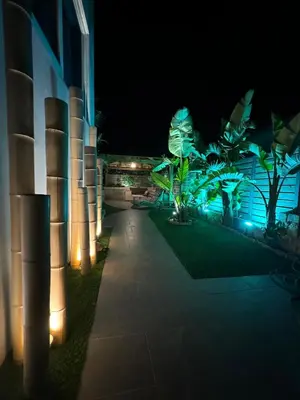 a building with lights on the side of it at night at Selini Seaview Villa in Kissamos