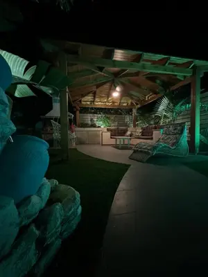 a night view of a patio with a table and chairs at Selini Seaview Villa in Kissamos