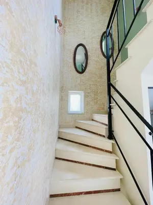 a staircase in a house with a mirror at Selini Seaview Villa in Kissamos