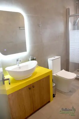 a bathroom with a sink and a toilet at Bellisima Campagna Cabin Pelekapina - Chania Crete in Chania Town