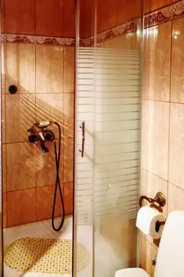 a bathroom with a shower with a glass door at Sweet Home Leo in Chania Town