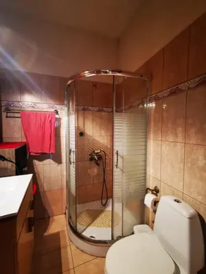 a bathroom with a shower with a toilet and a sink at Sweet Home Leo in Chania Town