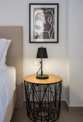 a table with a lamp on it next to a bed at Α Ηeaven View Park Gem - Chania Getaway in Chania Town
