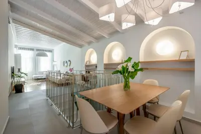 a dining room with a table and chairs at On Luxury Chania in Chania Town