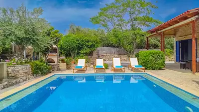a swimming pool with lounge chairs and a house at Lemon Tree Villa with Private Pool and Starlink Internet in Frés