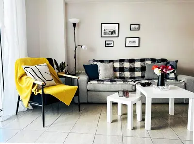 a living room with a couch and a table at Cozy Snuggle- 2min To Beach, 6min Walk To Old Town in Chania Town