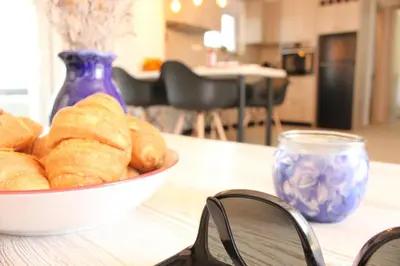 a bowl of bread on a table with a bowl of glasses at Phaedra House For Relaxing Holidays Near Platanias in Vlakheronítissa