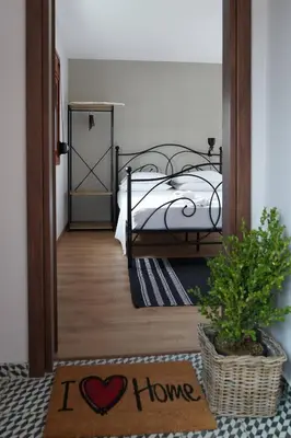 a bedroom with a bed and a sign that says i love at The Suite Spot - At The Heart Of The Old Town in Chania Town