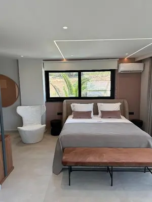 a large bed in a room with a window at Theta Boutique Hotel in Chania Town