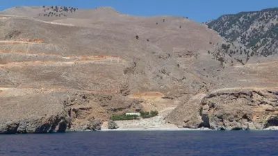 a view of a mountain with a body of water at Ilingas Hotel in Khóra Sfakíon