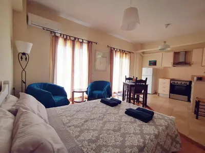 a bedroom with a bed with two towels on it at Leli House in Chania Town