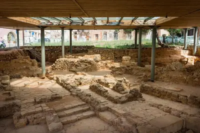 a building under a pavilion with ruins at Tatianas Kanevaro in Chania Town