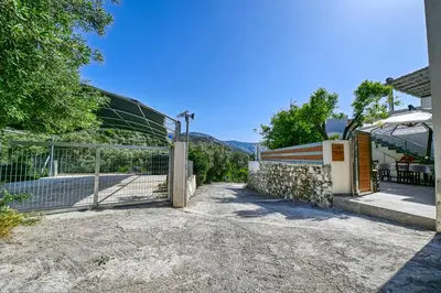 a gate in front of a building with a fence at Haroto Home Residence in Plokamianá