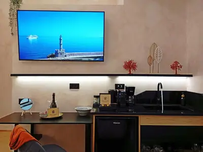 a flat screen tv hanging on a wall at Domus Vivendi in Chania Town