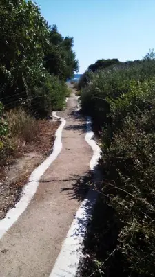 a dirt road with snow on the side of it at Vrachos Apartments in Frangokastello