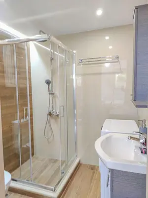a bathroom with a shower and a sink at Fully renovated Studio in Platanias in Plataniás