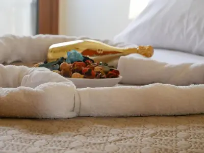 a bowl of food sitting on top of a bed at Giovanni City House near Chania City Center in Chania Town