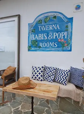 a living room with a couch and a table at Babis & Popi Rooms and Studios in Frangokastello