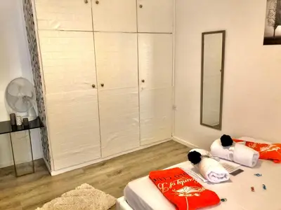 a room with a bed and a mirror and a closet at Lux and modern apartment Chania in Chania Town