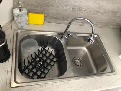 a kitchen sink with a dish drying rack in it at Lux and modern apartment Chania in Chania Town