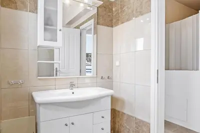 a bathroom with a sink and a mirror at Villa Blue Dreams in Maleme in Ayiá