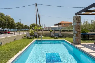 a swimming pool on the roof of a building at Villa Per Mare in Maleme