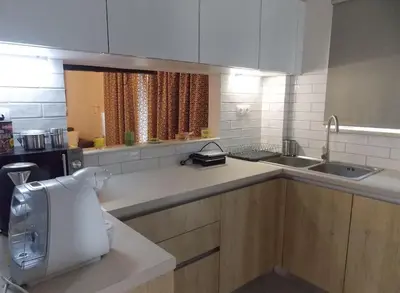 a kitchen with a sink and a counter top at Alena home in Chania Town