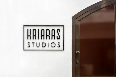 a sign that reads harras studios on a wall next to a door at Superb apartmentS Kriaras sea view in Sfakia in Khóra Sfakíon