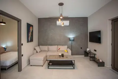 a living room with a couch and a bed at Makel Apartment in Chania Town