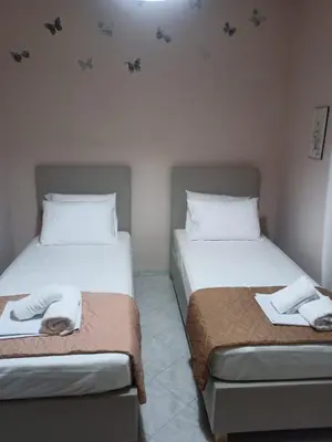 two beds sitting next to each other in a room at Giannis House in Kissamos in Kissamos